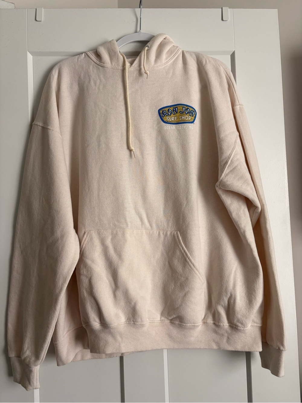 Ron Jon Cream Hoodie with Blue & Yellow Logo